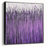 Framed canvas artwork showcasing vibrant abstract floral designs in shades of blue and pink, displayed in a sleek black frame, perfect for modern home decor.