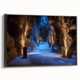Framed canvas artwork showcasing a stunning landscape with intricate cave formations, set against a black backdrop, ideal for modern home decor and art enthusiasts.