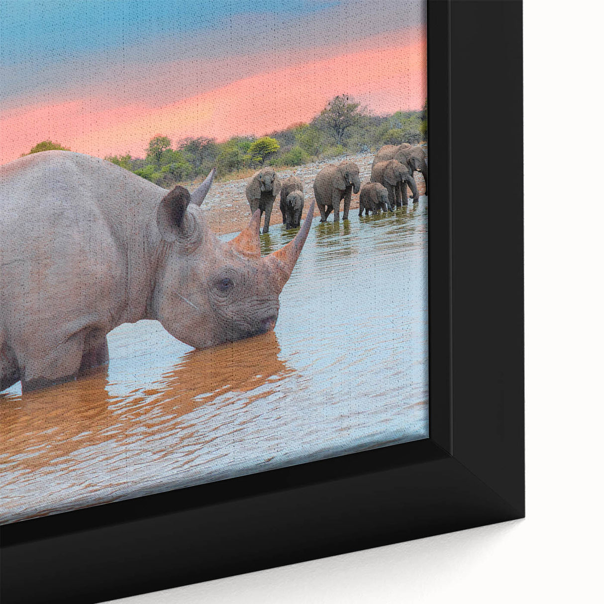 Extra large framed canvas featuring a textured depiction of an African scenery in black with colorful accents.