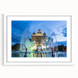 Abstract art print featuring a serene Laotian landscape in muted green and blue tones, framed with a white mat.