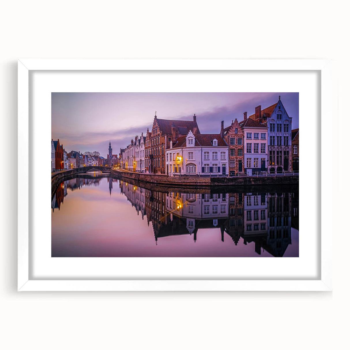 Abstract art print depicting a European cityscape in muted gray and blue tones, framed with a white mat.