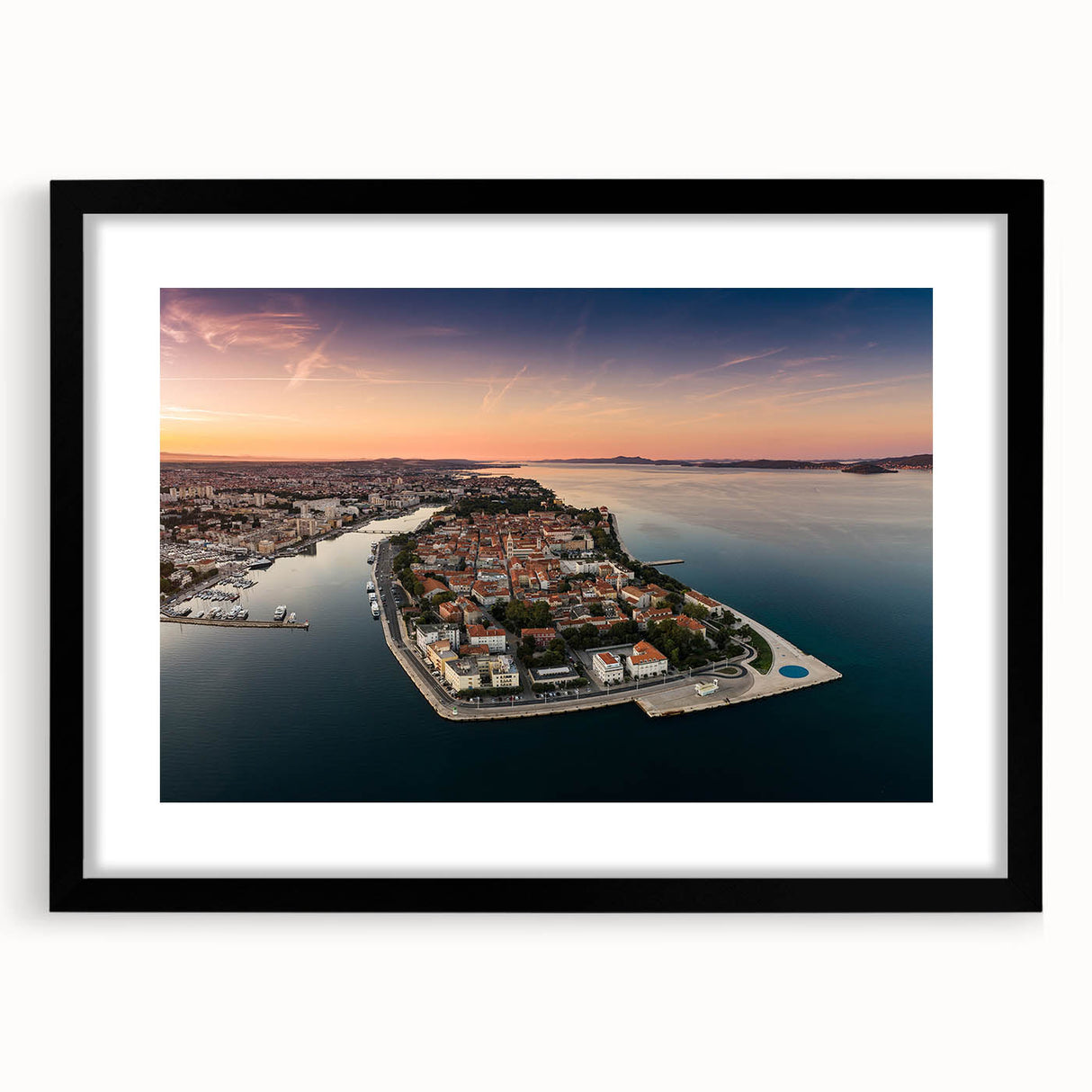 Extra large abstract art print of a colorful European scenery on a textured canvas, framed in black.