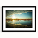 Abstract art print featuring vibrant, colorful textures of a European scenery, framed in black, ideal for living room decor.