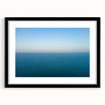 Extra large abstract art print of a vibrant, textured European scenery in a black frame, ideal for living room decor.
