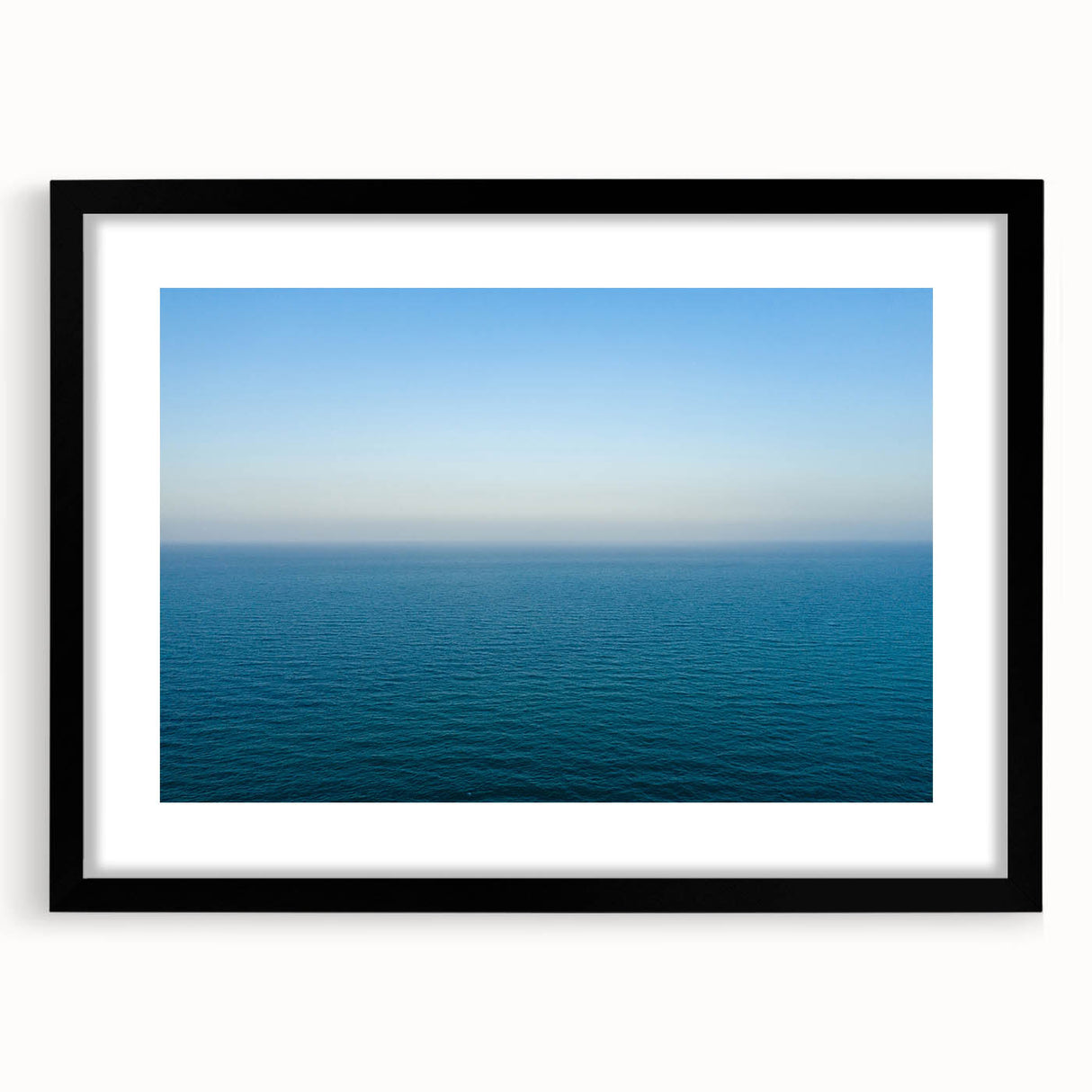 Extra large abstract art print of a vibrant, textured European scenery in a black frame, ideal for living room decor.