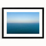 Extra large abstract art print of a vibrant, textured European scenery in a black frame, ideal for living room decor.
