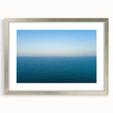 Extra large abstract art print depicting a textured European landscape in muted earth tones, framed in silver.