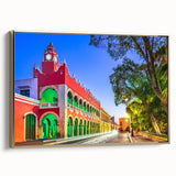 Framed canvas featuring a vintage-style landscape painting of the Yucatan in Mexico with gold frame.