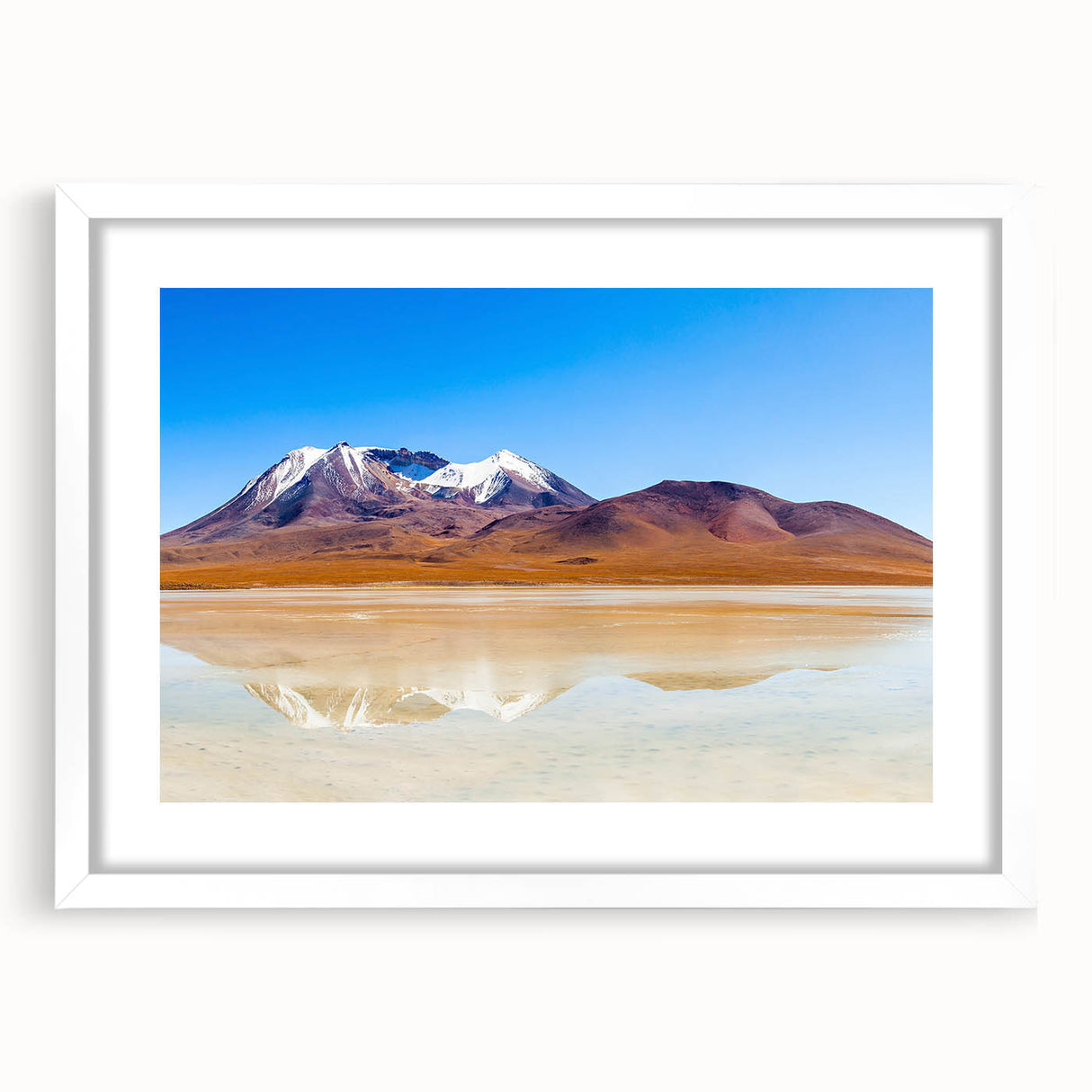 Abstract art print of a Bolivian landscape in muted earth tones on a framed white mat.