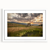 Abstract art print of Yellowstone scenery in muted earth tones, framed with a white mat.
