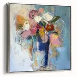 Framed canvas artwork featuring an abstract floral design in vibrant colors, elegantly presented with a sleek silver frame, ideal for modern home decor.