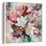 Framed canvas artwork showcasing an abstract floral design with vibrant colors on a white background, emphasizing modern home decor aesthetics. Perfect for adding a touch of elegance to any living space.