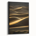 Framed canvas wall art showcasing a serene desert landscape with rolling dunes in warm beige and gold tones, featuring a sleek black frame, perfect for modern decor.