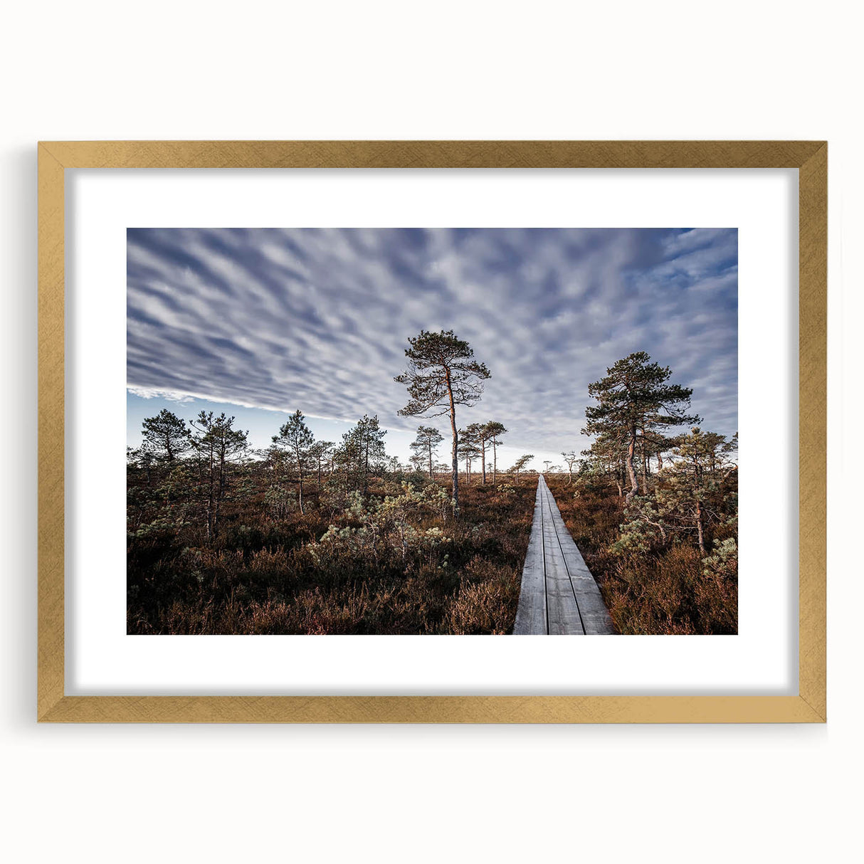 Abstract art print of a European landscape in muted gold and green tones, framed with a gold mat.