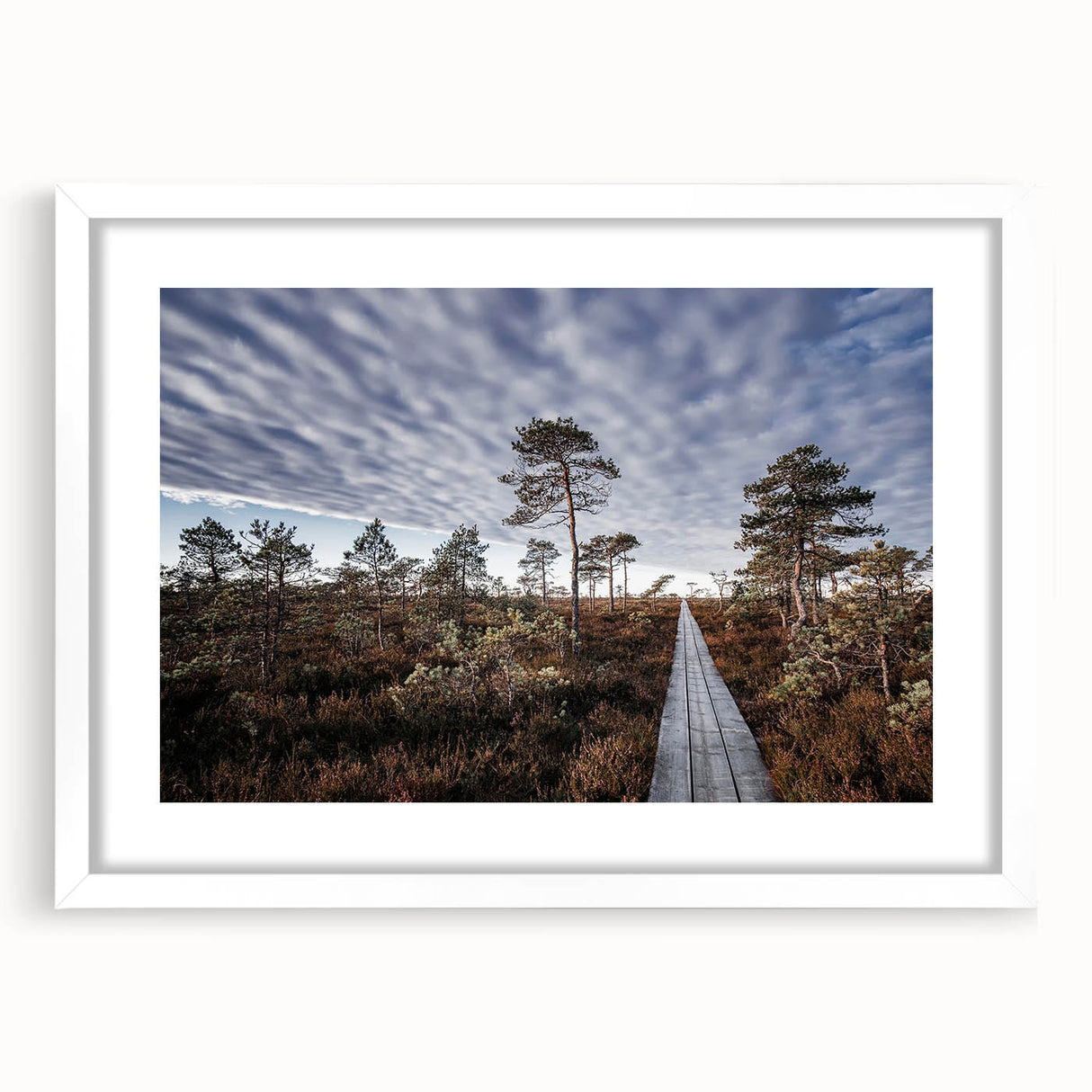 Textured abstract art print of a European scenery in muted earth tones on a framed white mat, suitable for bedroom decor.