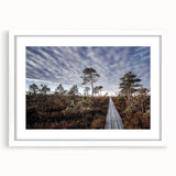 Textured abstract art print of a European scenery in muted earth tones on a framed white mat, suitable for bedroom decor.