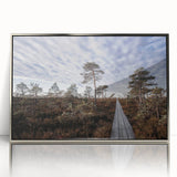 Large art print of a European Estonian landscape in muted greens and blues, framed in silver acrylic.