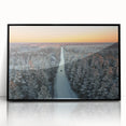 Large abstract wall art depicting a European landscape in muted tones, framed in black acrylic.
