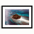 Abstract art print depicting an oceanic scene in vibrant blues and greens on a large textured canvas.