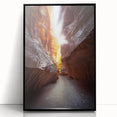 Framed acrylic artwork depicting a serene landscape with intricate cave formations, showcasing vibrant colors and modern black frame, perfect for home decor.