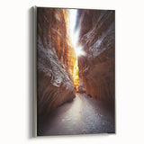 Framed canvas artwork showcasing a stunning landscape cave scene with silver accents, ideal for modern home decor. Side view highlights elegant framing.