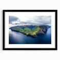 Black-framed landscape artwork showcasing dramatic cliffs against a vibrant sunset, elegantly matted to enhance the visual impact, perfect for modern home decor.