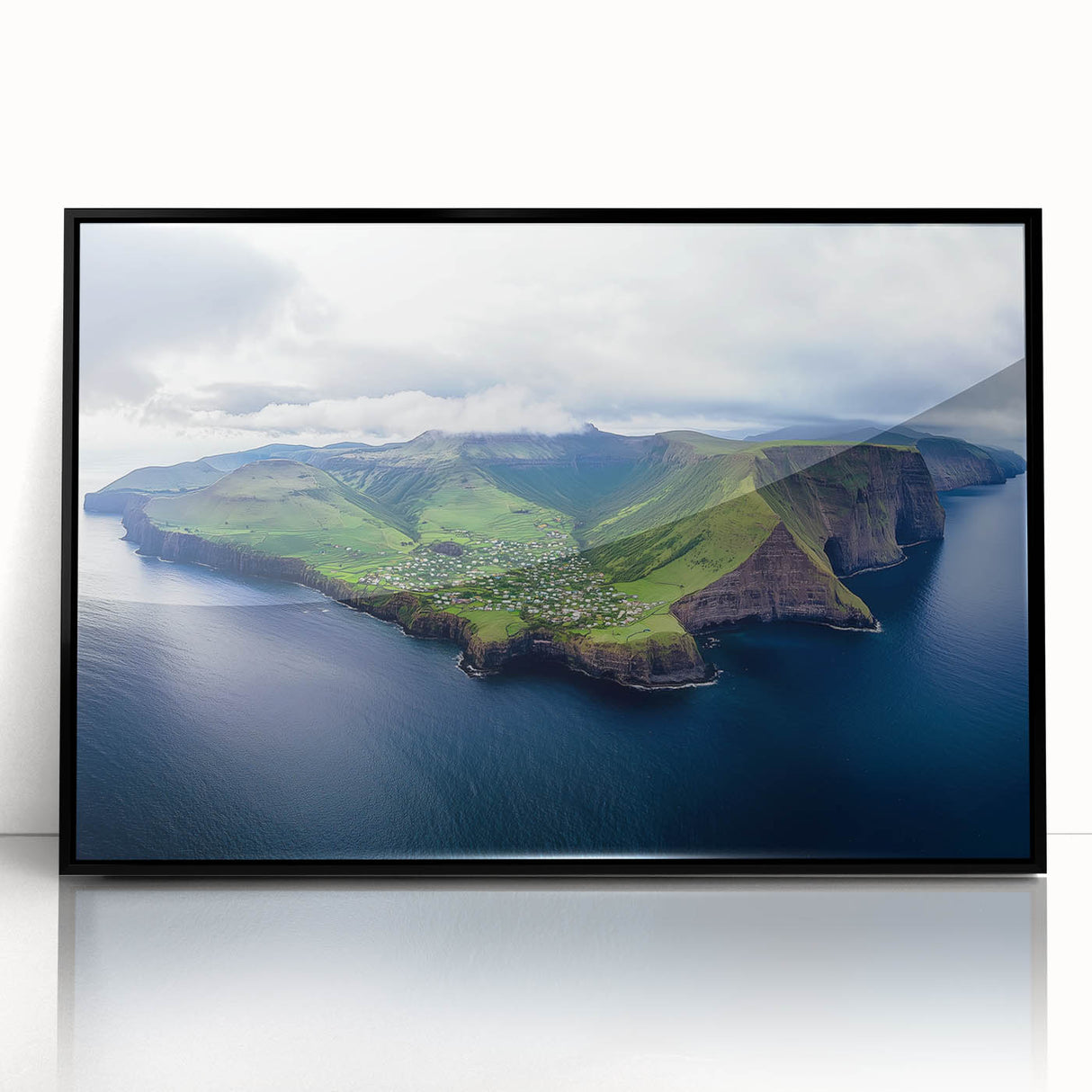 Framed acrylic landscape artwork showcasing dramatic cliffs and serene ocean waves, highlighted with a sleek black frame, perfect for modern home decor.