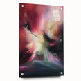 Abstract acrylic artwork featuring vibrant splatters in shades of blue, orange, and yellow, displayed in a side view with decorative pins in a modern setting.