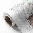 Rolled canvas depicting a serene landscape with a rustic barn set against a vibrant sunset, elegantly packaged in a protective cardboard tube for easy display.