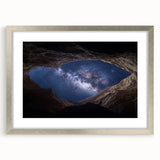 Framed landscape artwork depicting majestic canyons in vibrant colors, featuring a sleek silver frame and white matting, ideal for home decor enhancement.