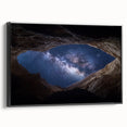 Framed canvas art showcasing a stunning landscape of canyons in rich earth tones, featuring a sleek black frame, ideal for enhancing modern home decor.