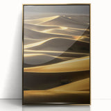 Framed acrylic artwork depicting serene desert dunes at sunset, showcased in a stylish gold frame, perfect for elevating modern home decor and adding warmth.