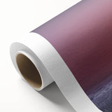 Rolled canvas artwork showcasing a vibrant landscape scene with lush green fields under a clear blue sky, elegantly packaged in a protective cardboard tube for safe shipping.