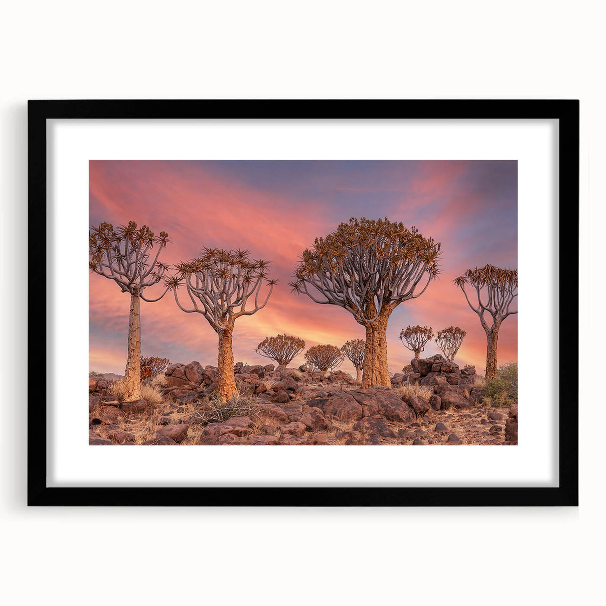 Abstract art print of an African landscape in colorful textured tones on a large framed canvas, ideal for living room decor.