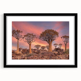 Abstract art print of an African landscape in colorful textured tones on a large framed canvas, ideal for living room decor.