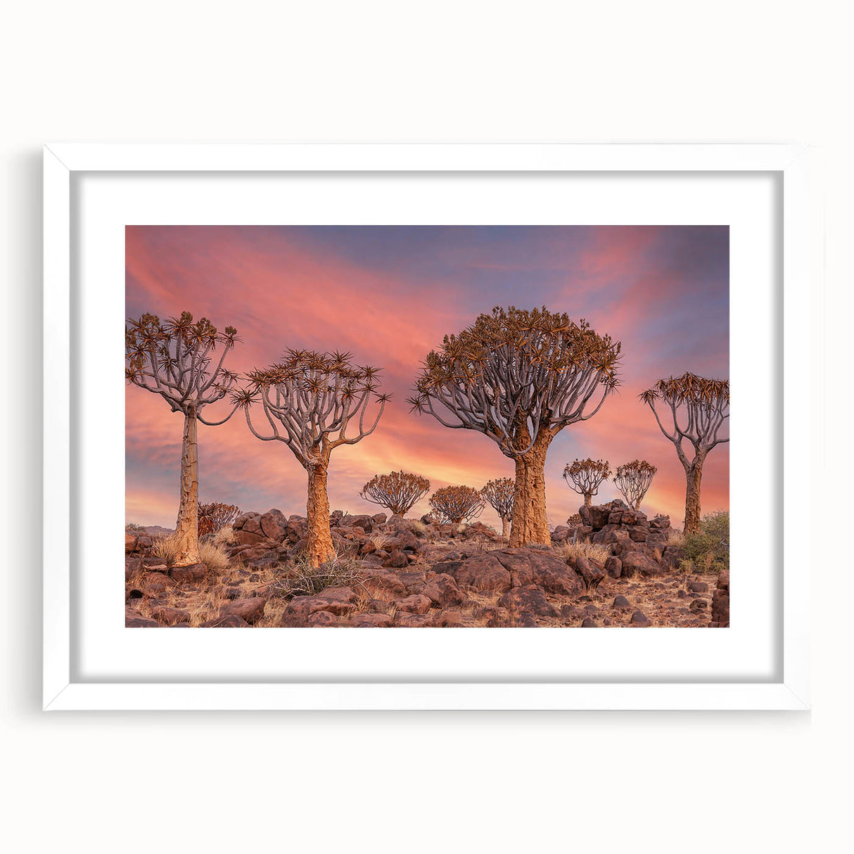 Extra large abstract art print of a Namibian landscape in muted earth tones on a textured canvas, framed in white.