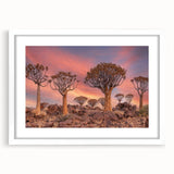 Extra large abstract art print of a Namibian landscape in muted earth tones on a textured canvas, framed in white.