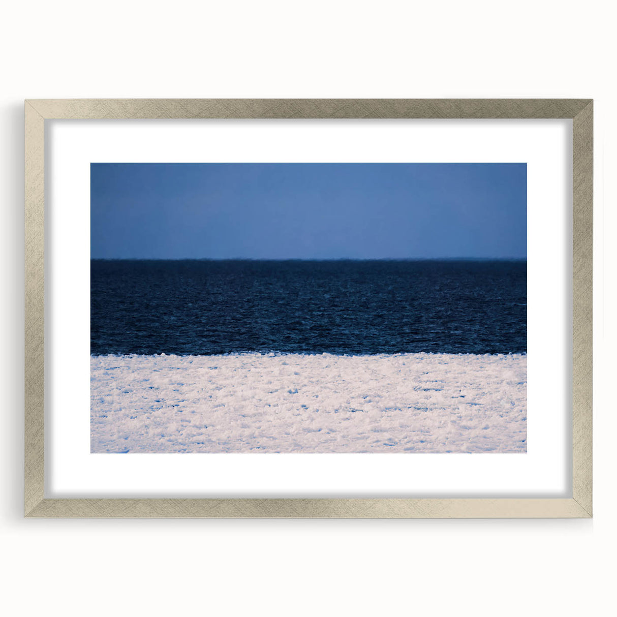 Extra large abstract art print depicting a textured European scenery in muted earth tones, framed in silver.
