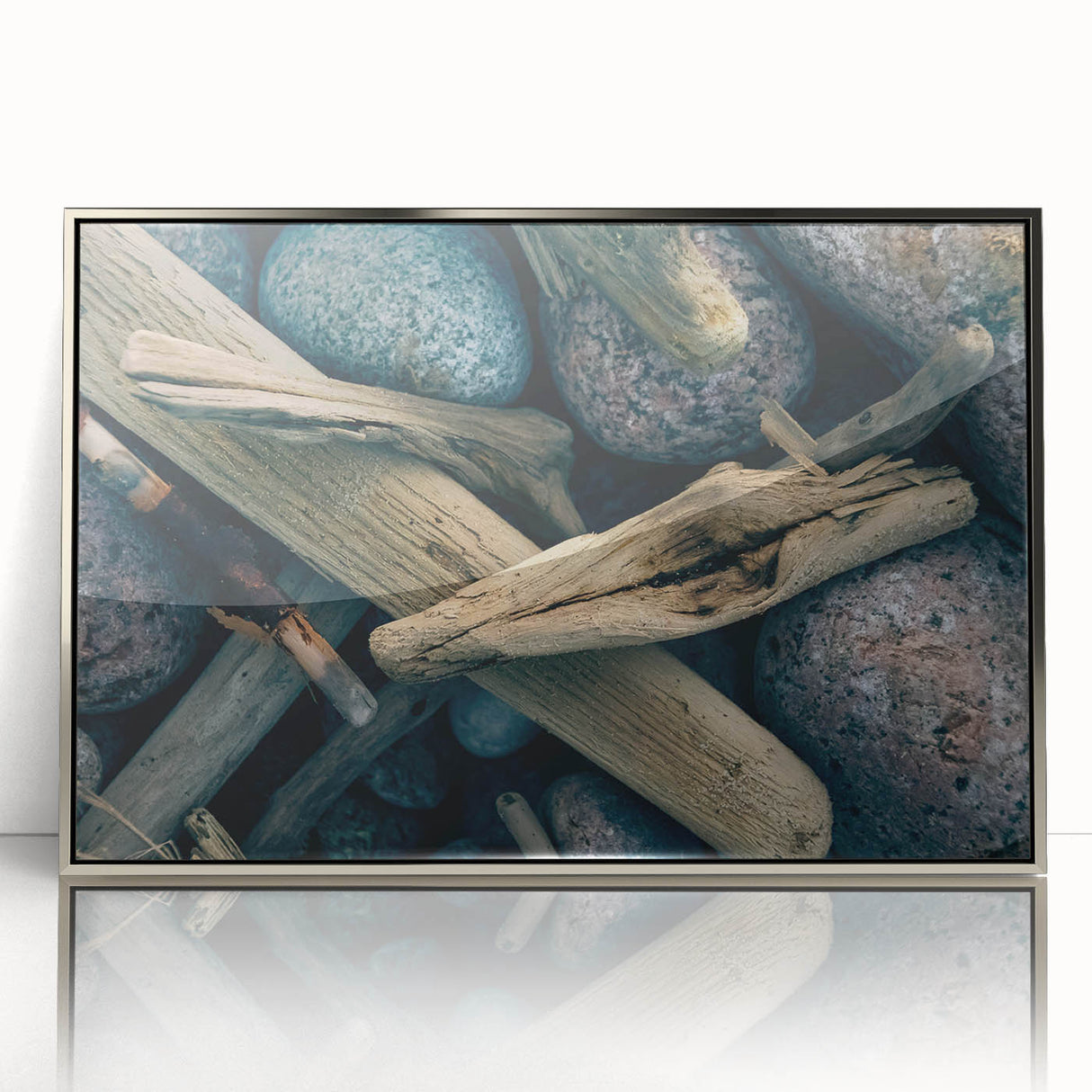 Large art print of a Lithuanian landscape in muted green and blue tones, framed in silver acrylic.