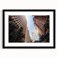 Extra large abstract art print of a vibrant, colorful South American scenery on a textured canvas, framed in black.