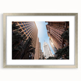 Abstract textured art print depicting a stylized Brazilian landscape in earth tones, framed in silver.