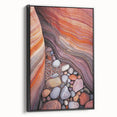 Framed canvas artwork depicting a stunning desert landscape with vibrant colors and intricate details, showcasing a black frame from a side perspective.