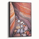 Framed canvas artwork depicting a stunning desert landscape with vibrant colors and intricate details, showcasing a black frame from a side perspective.