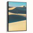 Framed canvas art depicting serene sand dunes in soft beige and gold tones, showcasing an elegant black frame, perfect for modern home decor.