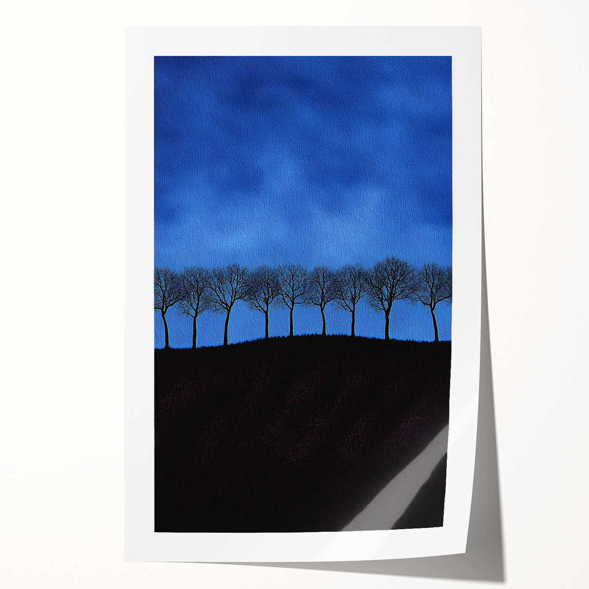 Vibrant rolled print showcasing a picturesque landscape with lush green fields under a bright blue sky, elegantly packaged in a protective cardboard tube, ideal for home decor.
