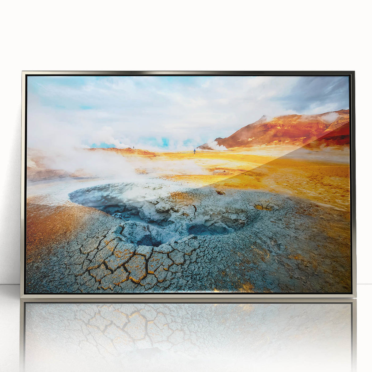 Large art print of a serene Icelandic landscape in muted blue and green hues, framed in silver acrylic.