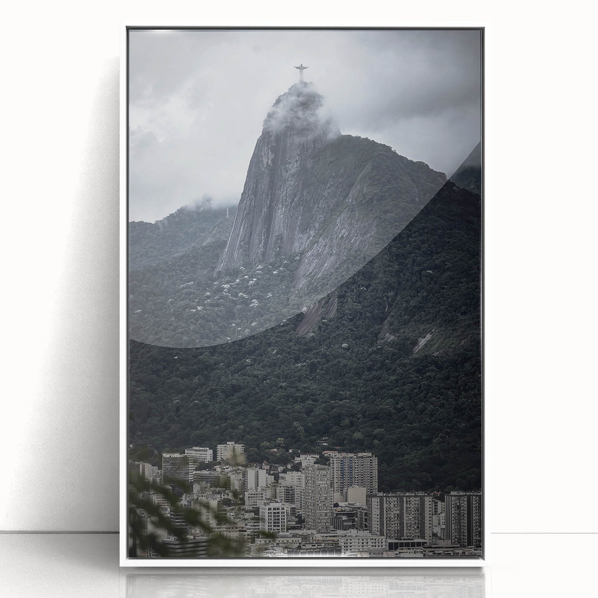 Art deco poster featuring a stylized Brazilian landscape in muted green and yellow tones, framed in white acrylic.