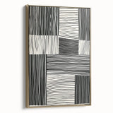Framed abstract minimalist wall art featuring a gold design on a sleek canvas, viewed from the side, perfect for modern home decor and stylish interiors.