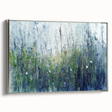 Framed canvas print showcasing abstract floral designs in vibrant colors, elegantly set against a sleek silver frame, ideal for contemporary home decor.