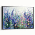 Framed canvas artwork showcasing an abstract floral design in vibrant colors, set against a sleek black frame. Perfect for modern home decor or art enthusiasts.